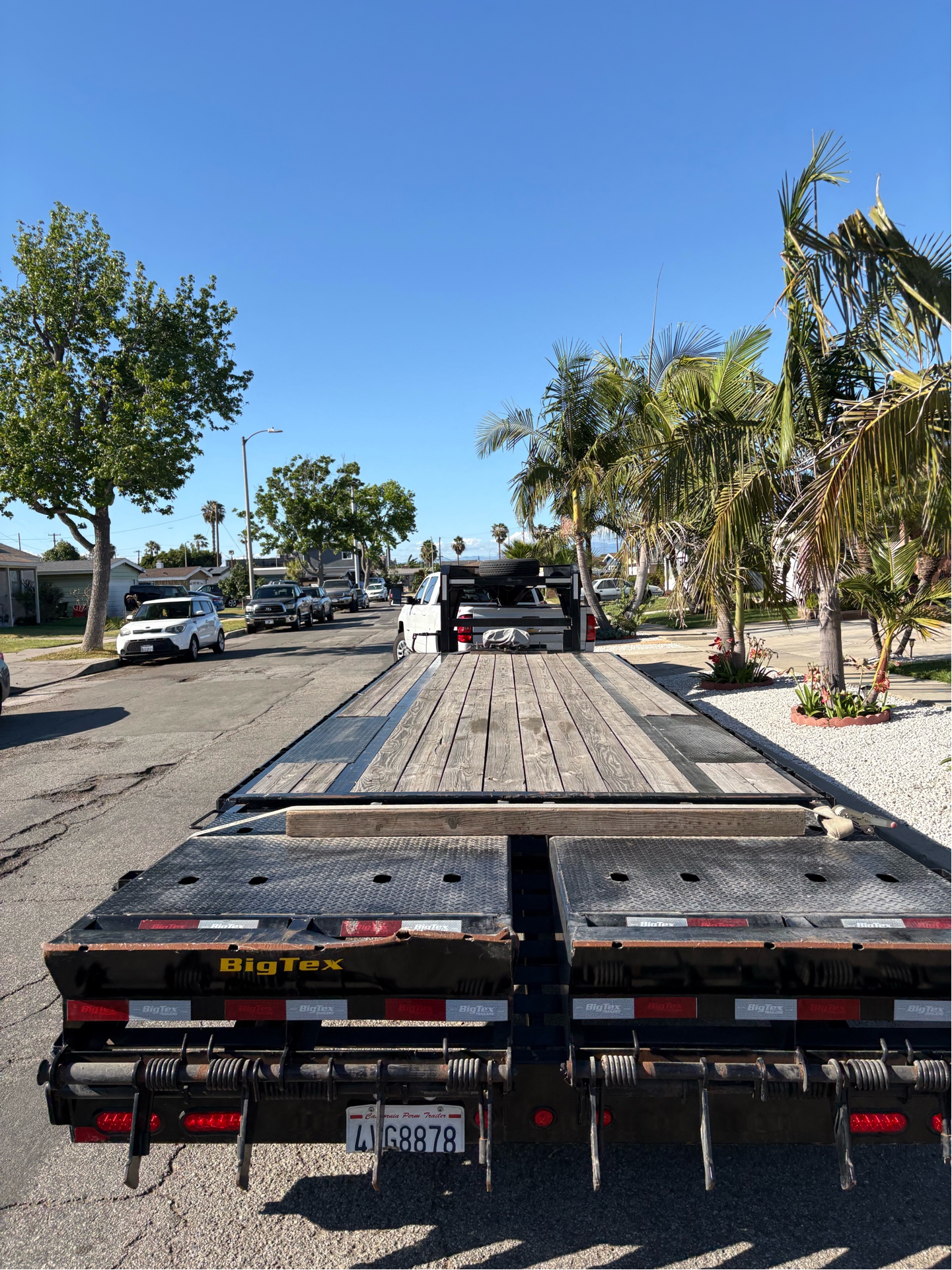 Big Tex flatbed gooseneck trailer rear view showing ramps